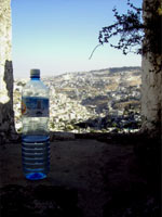 Bottled water. An old city.